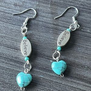 “Believe” earrings with blue gemstone hearts